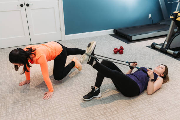 Person performing bodyweight squats in a home living room